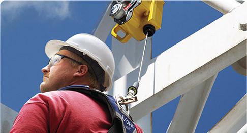 Who can select an anchor point for a fall protection system?